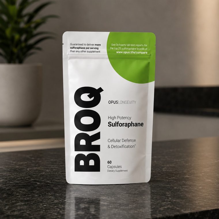 The BROQ pouch, white with a green corner, on a dark stone counter.