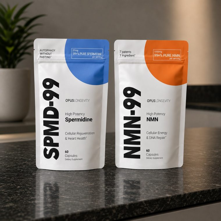 The SPMD-99 and NMN-99 pouches standing side by side on a dark stone counter.